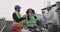 Two architects and one engineer lady African ethnic celebrating the birthday of the rooftop of construction site she