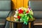 Two arm chairs leather and marble table, and bouquet of red rose