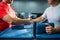 Two arm wrestlers shake hands after battle