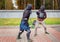 Two armed men lead a sword fight, a medieval fight, at a fun medieval tournament