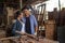 Two asian carpenters in a construction workshop. business man and woman working together woodwork