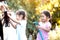 Two asian child girls having fun to help parent washing car