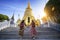 Two asian girlfriends traveling and check location by a map in Grand Palace
