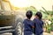 Two asian girls helping parent washing a car