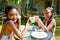 Two Asian Girls in Swimsuit Having Some Meals and Drinks and Fun Together After Swimming Activities at The Hotel