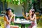 Two Asian Girls in Swimsuit Having Some Meals and Fun Together After Swimming Activities