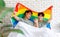 Two Asian happy cheerful romantic lovely teenager male gay men lover couple partner smiling lying down holding hands cuddling