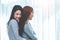 Two Asian Lesbian women hug and embracing together in bedroom. Couple people and Beauty concept. Happy lifestyles and home sweet