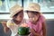 Two asian little girls are drinking watermelon blended juice