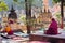 Two asian men thinking and meditating in a historic park of the buddhist temple