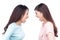 Two asian women shouting each other against white background.