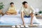 Two Asian young upset unhappy stressed depressed sad teenager male gay men lover couple partner sitting in different corners on