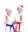 Two athletes in caps of Santa Claus are standing in rack