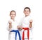 Two athletes in karategi are standing in the rack of karate