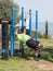 Two athletes perform exercises on outdoor public exercise machines in the open air in Zefat city in Israel