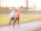 Two athletes on roller skates ride on a training paved track. Active and healthy lifestyle. Preparing for the competition. Winter