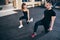 Two athletes working out with hand weights