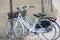 Two attached bicycles near the beach