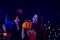 Two attractive Asian woman wearing witch costume holding pumpkin dancing in Halloween party