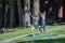 Two attractive females doing yoga in the park