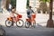 Two attractive females on rental bikes