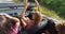 Two attractive girls driving in convertible with the top down