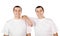 Two attractive positive smiling young men twins isolated