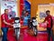 two automobile sales advisors displayed latest bike with rate comparing at hero motorcycle showroom in India January 2020