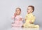 two babies talking on white background.