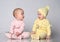 two babies talking on white background