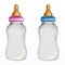 Two baby bottles with milk
