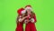 Two baby girls look at the pictures on the phone and laugh. Green screen. Slow motion