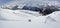 Two backcountry skiers hiking to a far away mountain peak in the Austrian Alps in winter