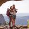 Two backpackers in mountains.