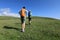 Two backpacking women friends hiking