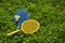 Two badminton rackets on the green grass