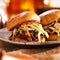 Two barbecue pulled pork slider sandwiches
