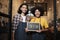 Two barista partners letter and show an open sign, new business entrepreneurs