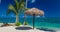 Two beach chair under umbrella with palm trees, Samoa