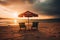 Two beach chairs and a little table with a colorful parasol directly on the beach during sunset created with generative AI