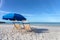 Two Beach Chairs and Umbrella on Beach