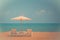 Two beach chairs and white umbrella on the tropical beach