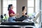 Two beautiful, Asian overweight women working out on treadmill in fitness club together. Weight loss workout, healthy lifestyle