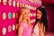 Two beautiful blonde and brunette girls closeup on the pink donut background