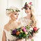 Two Beautiful Blonde Women Fiancee. Fashion Model with Flowers