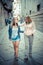 Two beautiful blonde women walking and talking