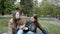 Two beautiful brunette girls sisters talking at the park