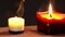 Two beautiful candles of different shapes on the table in a romantic setting. Burning romantic candles.