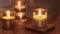 Two beautiful candles of different shapes on a wooden table in a romantic setting. Burning romantic candles