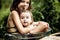 Two beautiful children bathe in nature